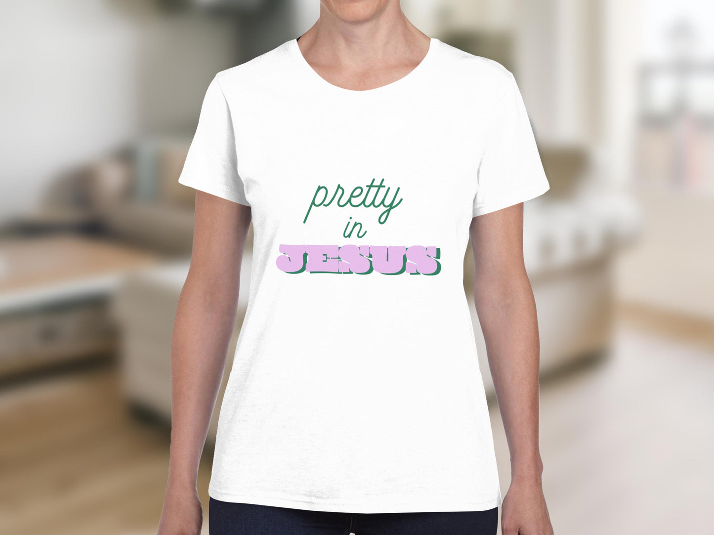 White t-shirt with "pretty in JESUS" text in green and pink.