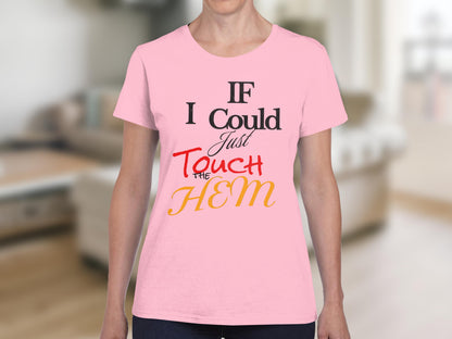 Pink t-shirt with "If I Could Just Touch THE HEM" text in black and orange.