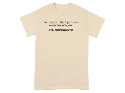 Cream t-shirt with black text: "Remember the Sparrows and the lilies of the field. HE WILL PROVIDE FOR YOU TOO."