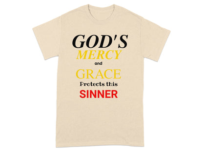 Cream t-shirt with text: GOD'S MERCY and GRACE Protects this SINNER.