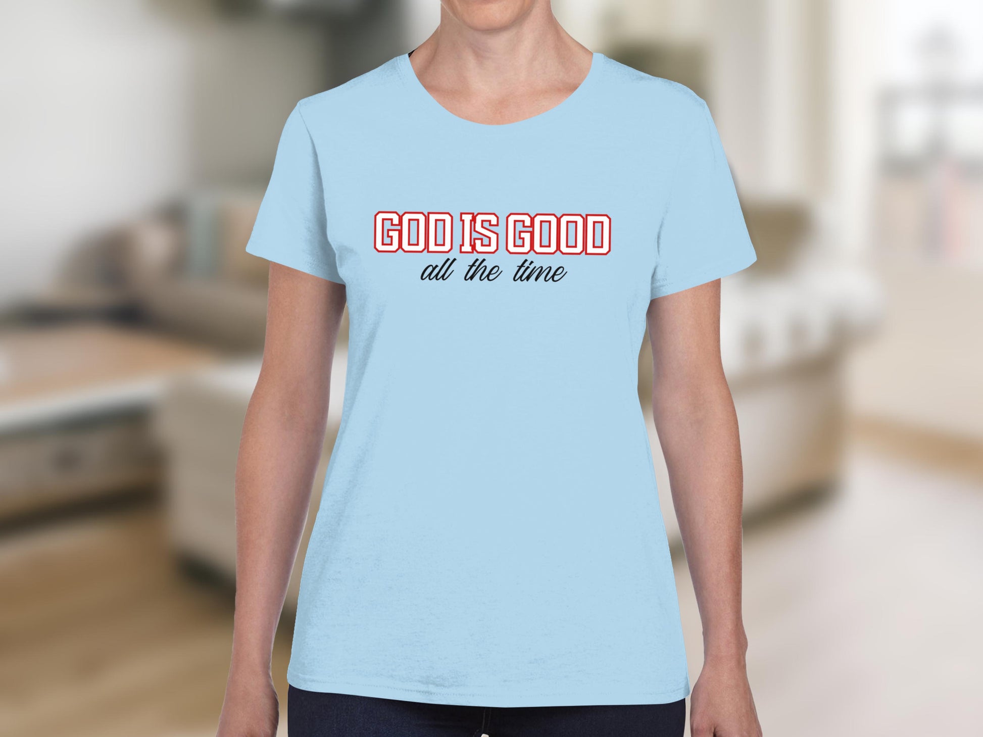 Light blue t-shirt with "GOD IS GOOD all the time" text.