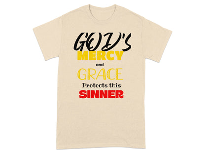 Beige t-shirt with "God's Mercy and Grace Protects this Sinner" text.