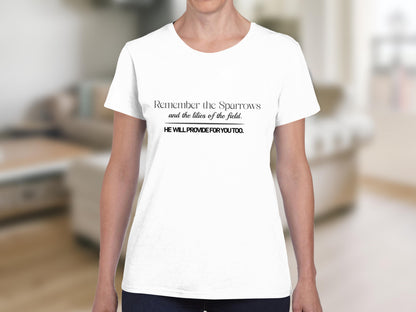 White t-shirt with text: "Remember the Sparrows and the lilies of the field. HE WILL PROVIDE FOR YOU TOO."