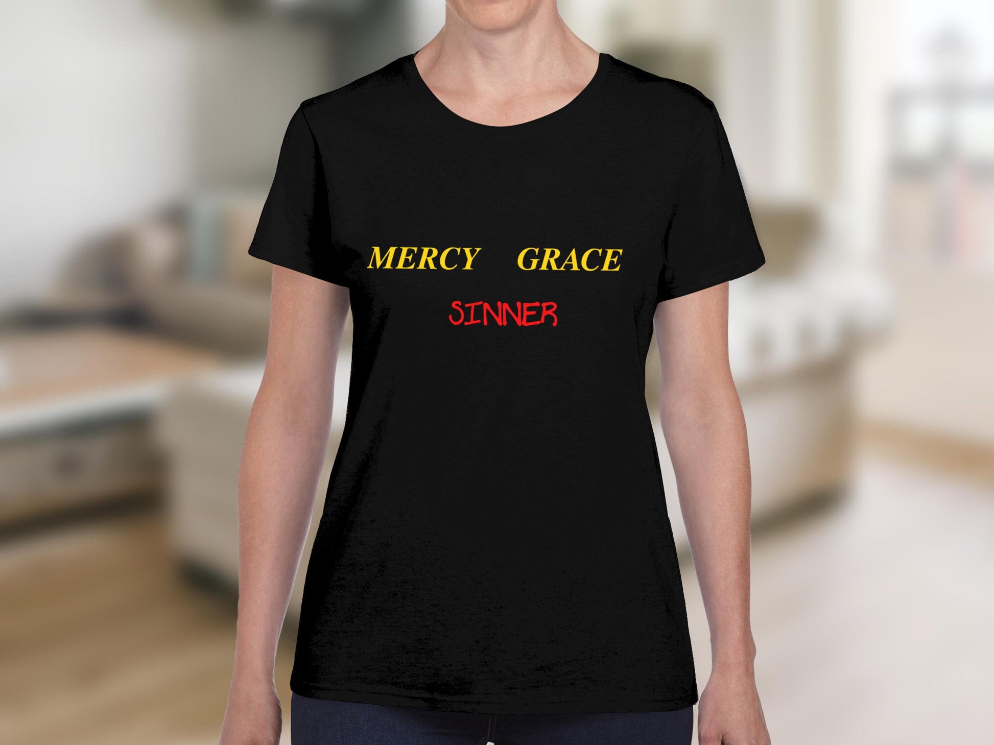 Black t-shirt with yellow text "MERCY GRACE" above red text "SINNER".