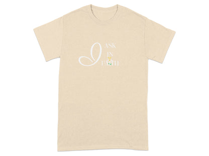 Cream t-shirt with white "I ASK IN FAITH" text and small flower graphic.