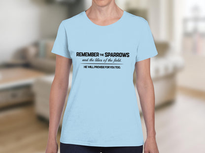 Light blue t-shirt with black text: "Remember the Sparrows and the lilies of the field. He will provide for you too."