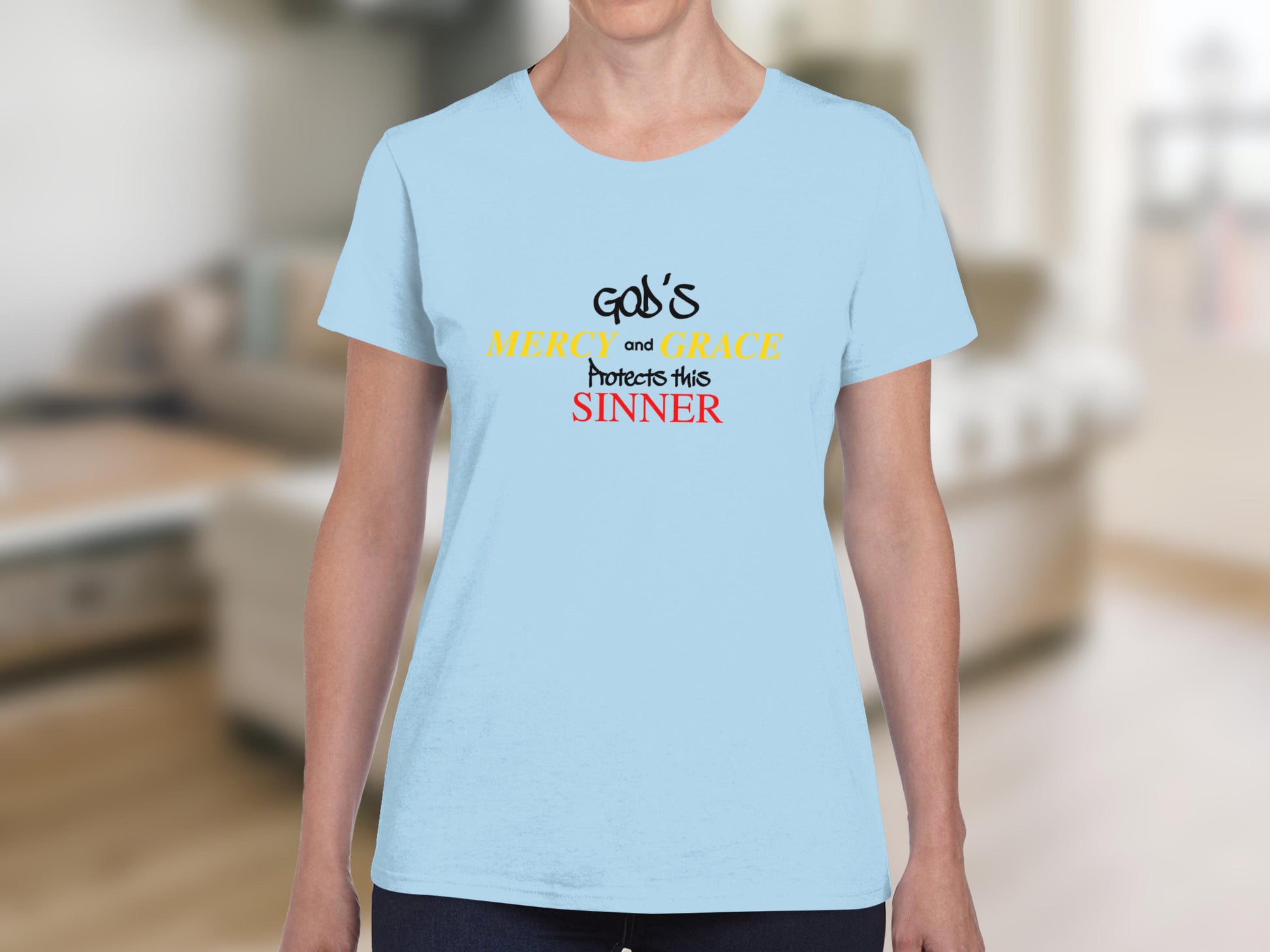 Light blue t-shirt with "God's MERCY and GRACE Protects this SINNER" text.