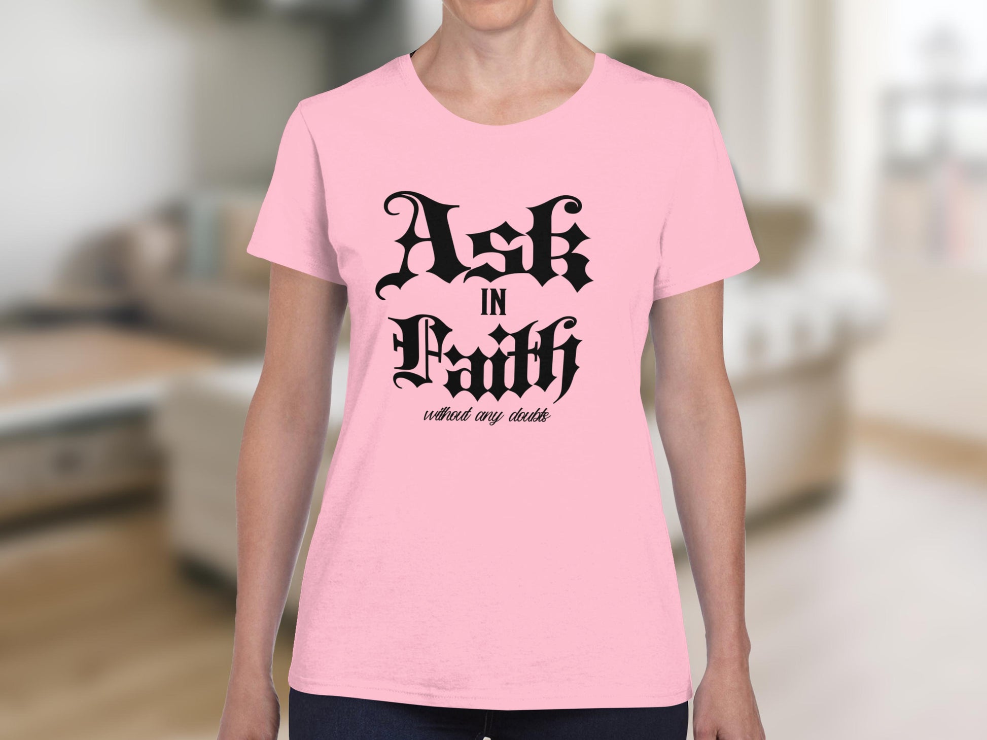 Pink t-shirt with "Ask In Faith without any doubts" text.