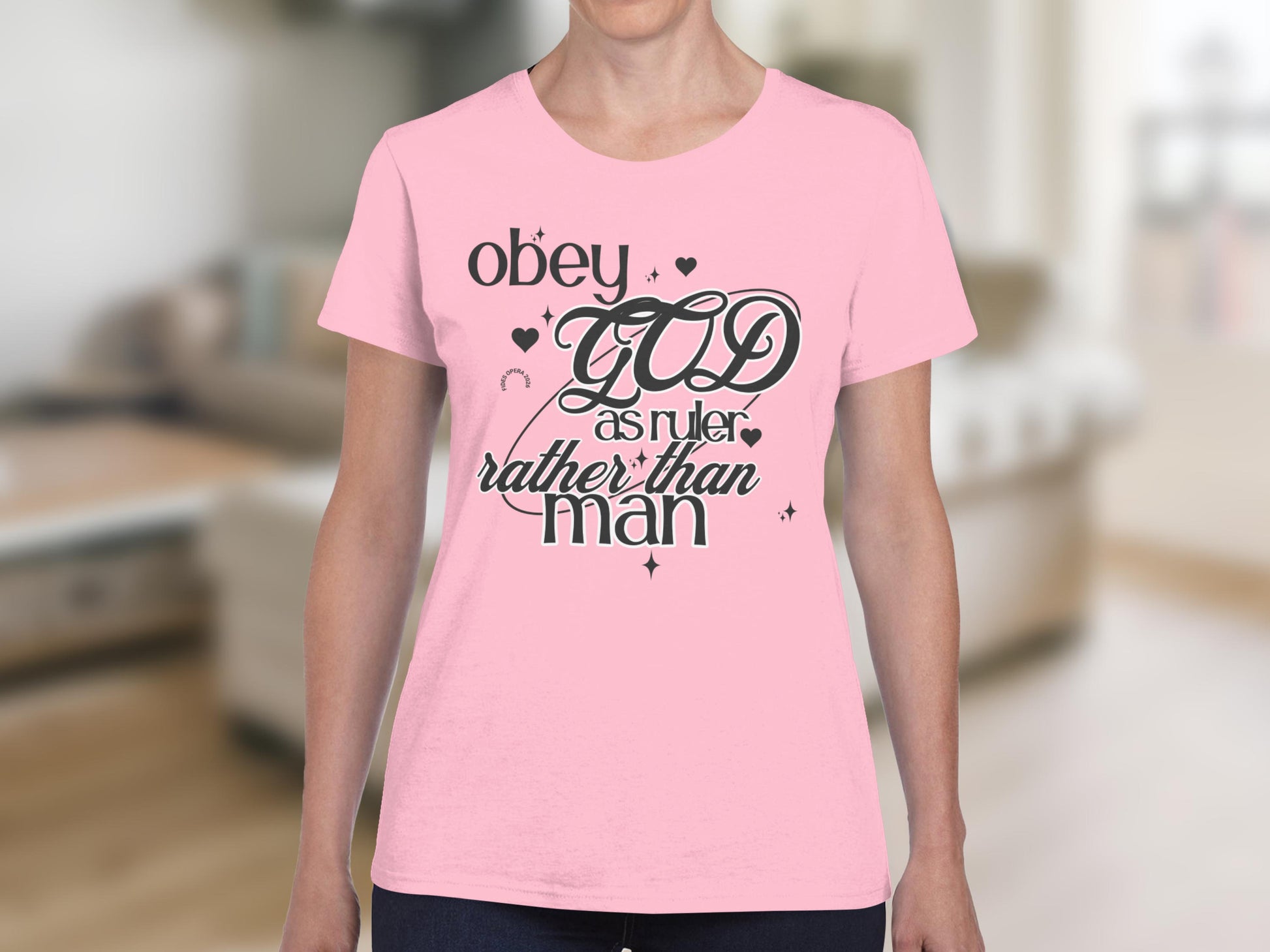 Pink t-shirt with "Obey GOD as ruler rather than man" text design.