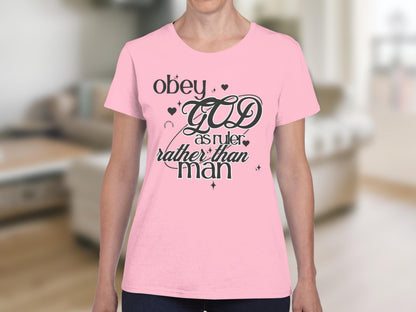 Pink t-shirt with "Obey GOD as ruler rather than man" text design.