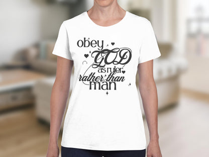 White t-shirt with "obey GOD as ruler rather than man" text.