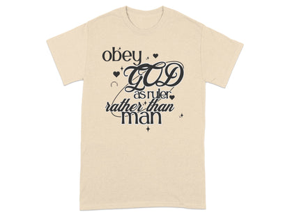 Cream t-shirt with black text reading "obey GOD as ruler rather than man".