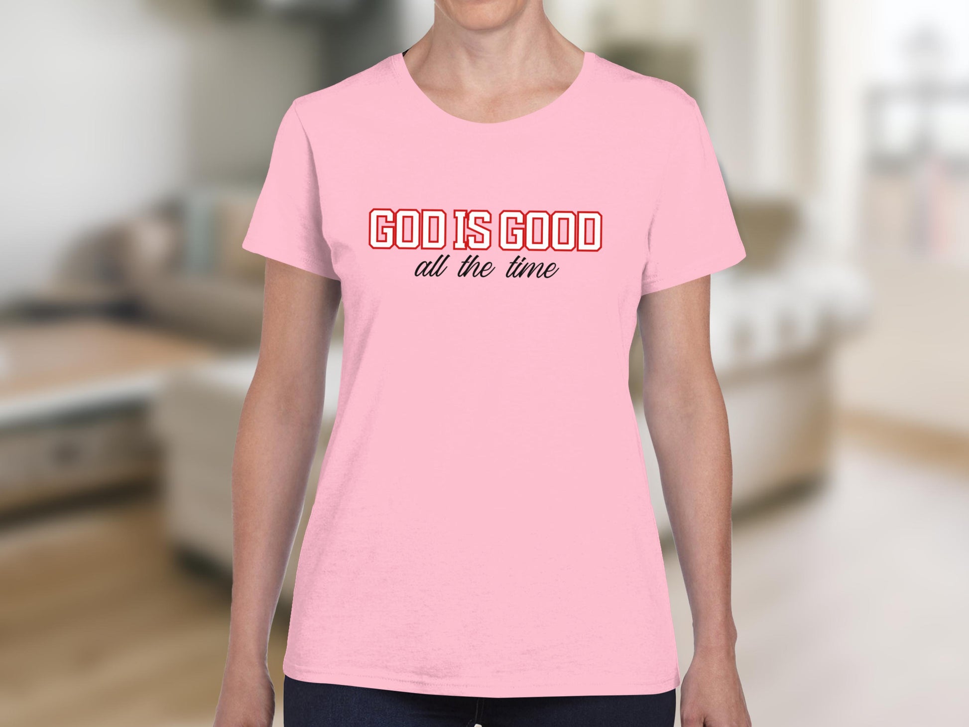 Pink t-shirt with "GOD IS GOOD all the time" text.