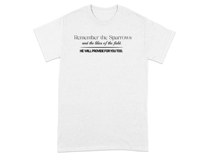 White t-shirt with black text: "Remember the Sparrows and the lilies of the field. HE WILL PROVIDE FOR YOU TOO."