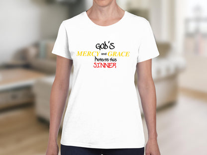 White t-shirt with "God's Mercy and Grace Protects This Sinner" text.