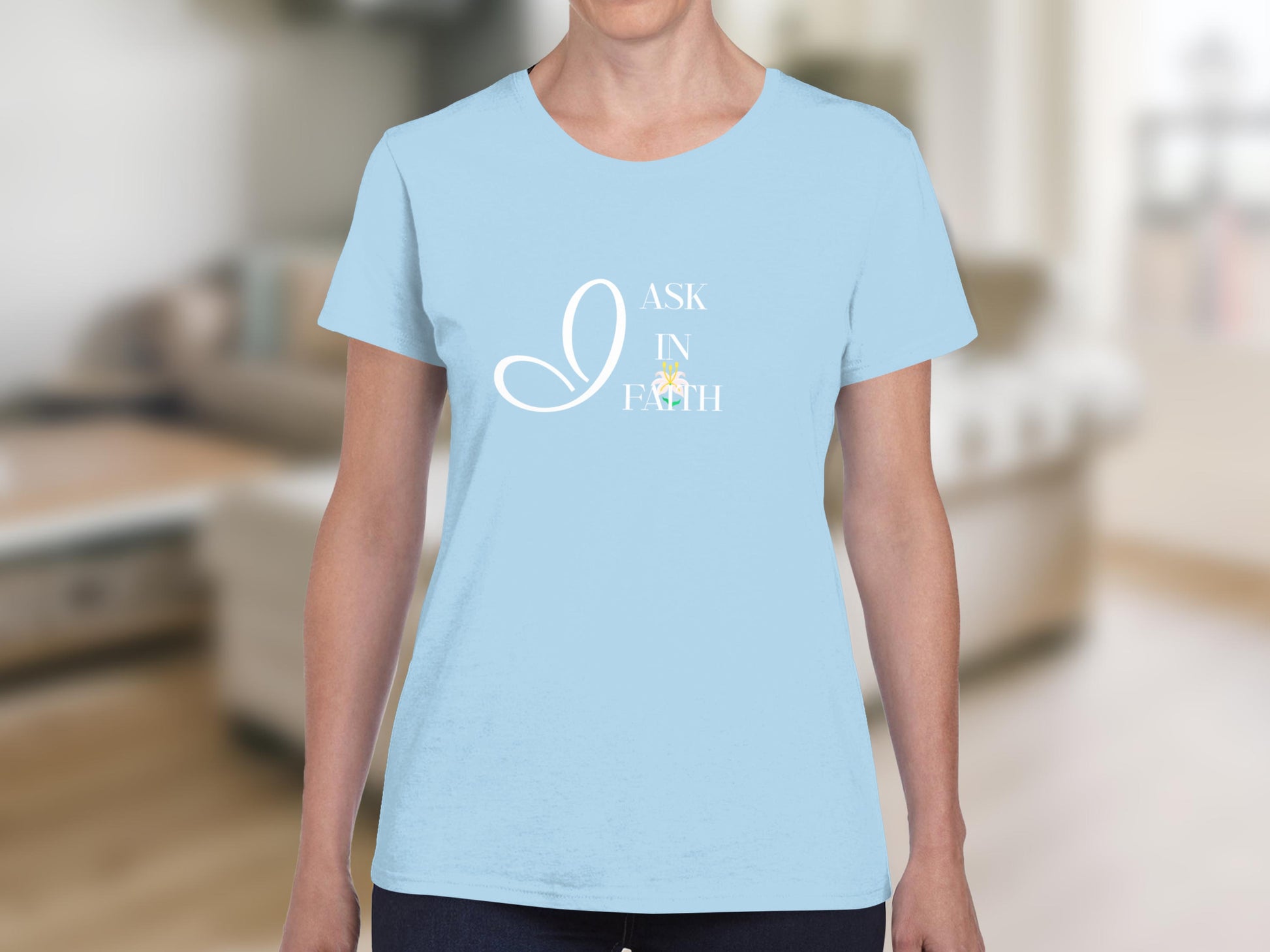 Light blue t-shirt with "I ASK IN FAITH" text and colorful accents.