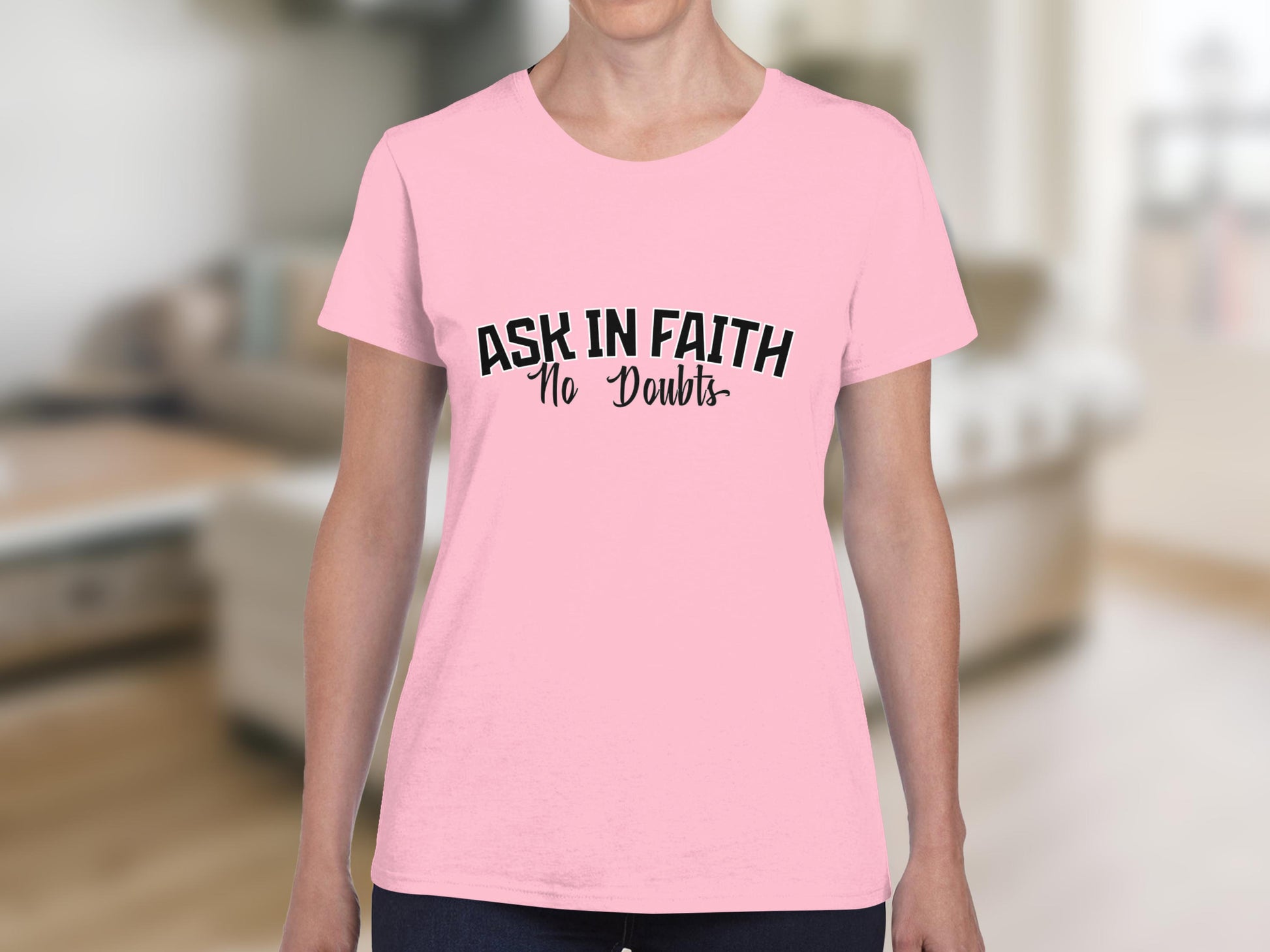 Pink t-shirt with "ASK IN FAITH No Doubts" text.